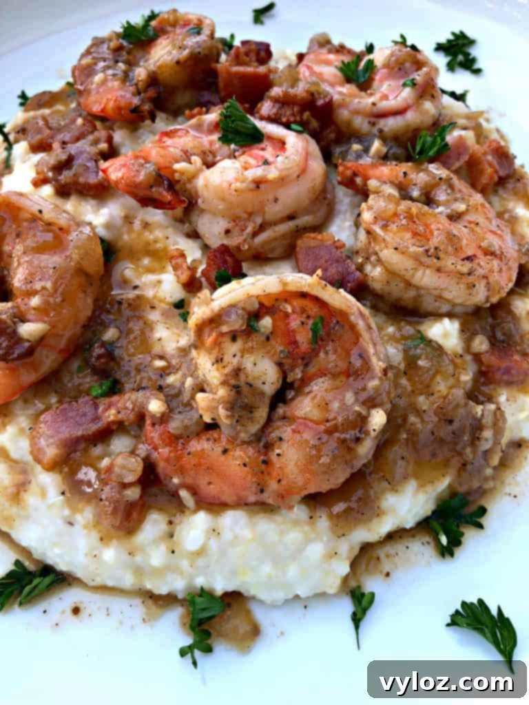shrimp and grits on a white plate