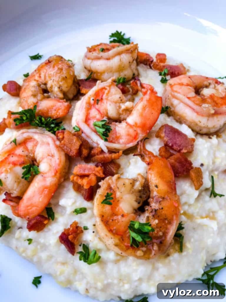 shrimp and grits on a white plate