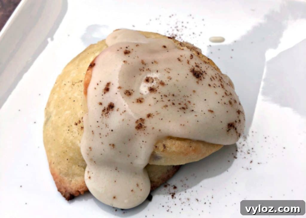 keto fathead cinnamon rolls on a white plate