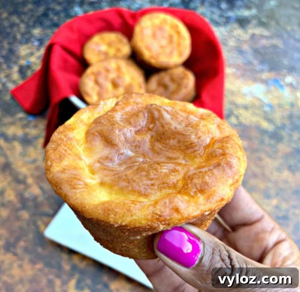 Person holding a freshly baked keto biscuit