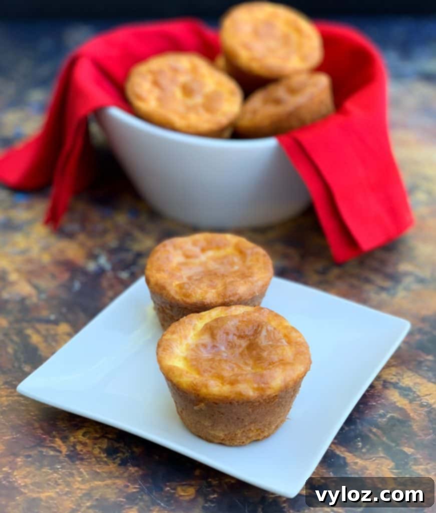 Close-up of fluffy keto biscuits in a white bowl