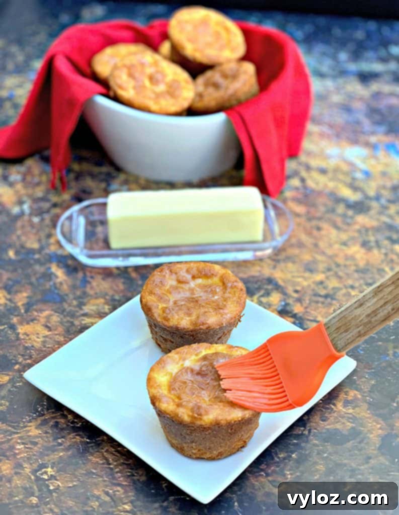 Freshly baked keto biscuits in a white bowl
