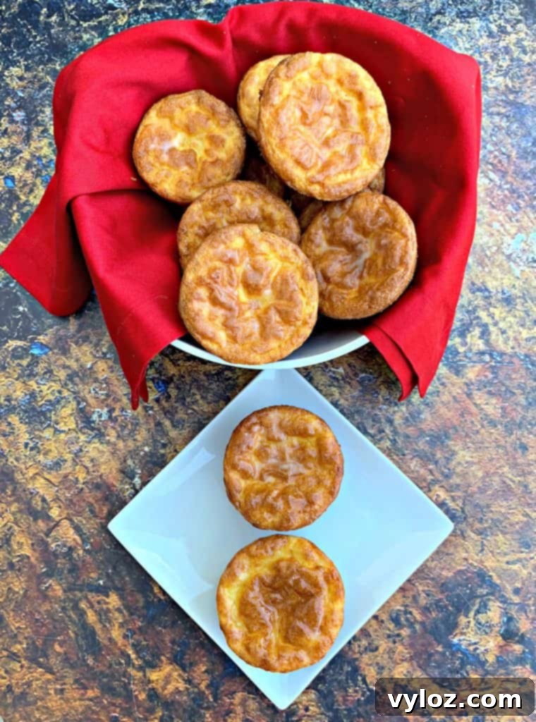 Another view of keto biscuits in a white bowl