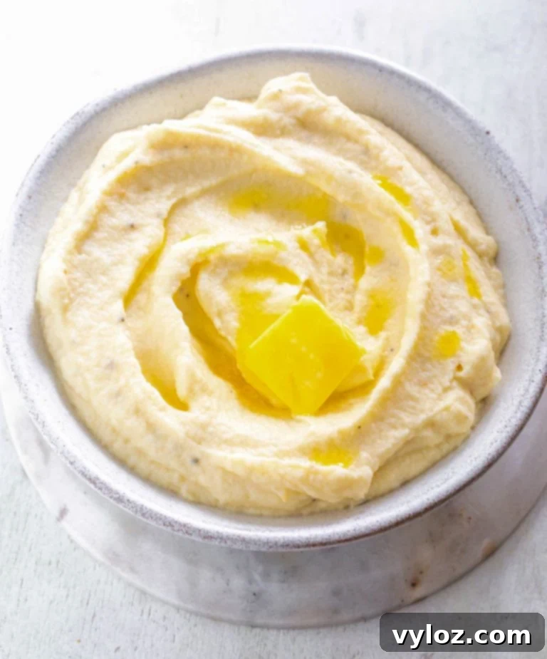 Keto cauliflower mashed potatoes in a glass bowl, ready to be served