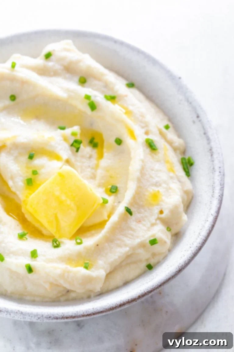 Close-up of keto cauliflower mashed potatoes in a serving bowl