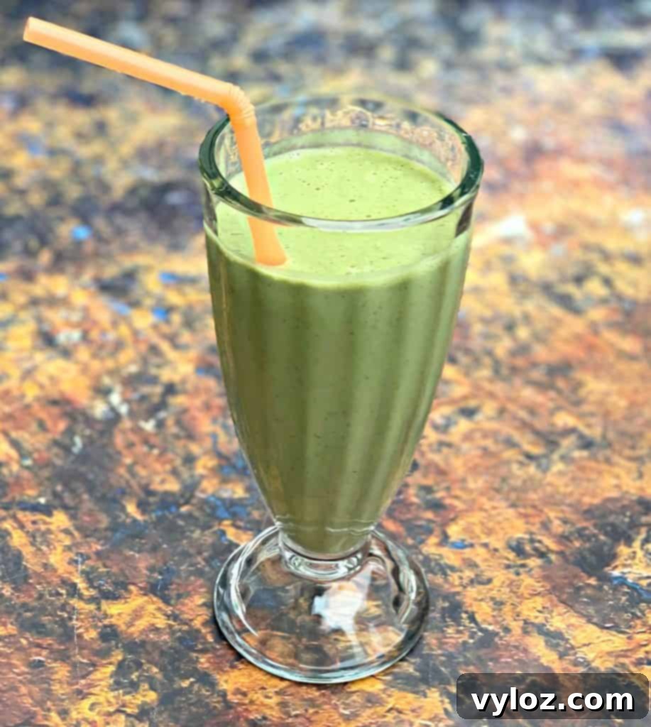 Creamy Strawberry Peanut Butter Delight 5 Perfectly blended strawberry peanut butter smoothie in a glass with a straw