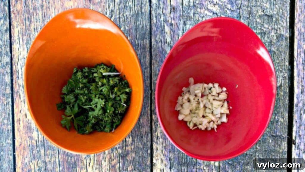 parsley and garlic in red and orange bowls