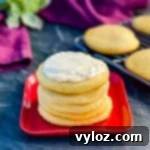 keto low carb sugar cookies on a red plate with cream cheese frosting