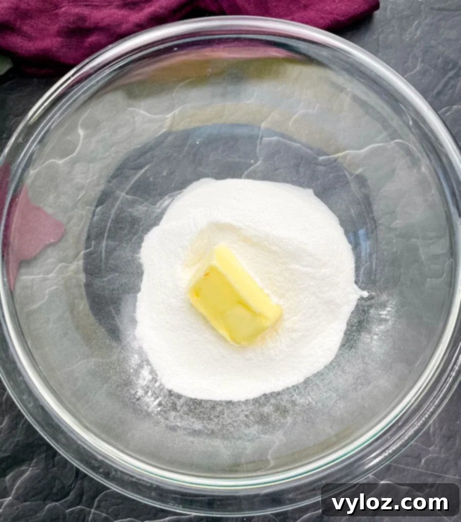 Close-up shot of keto low carb gluten free sugar cookie dough in a mixing bowl, showcasing its smooth texture.