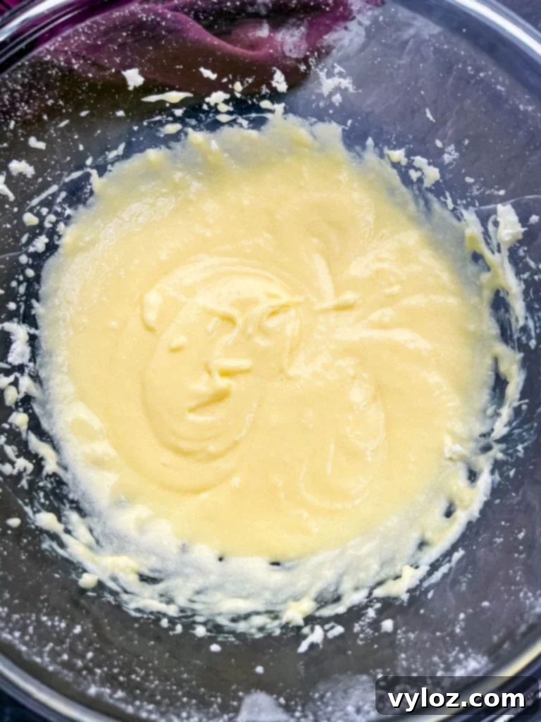 Assortment of freshly baked keto low carb sugar cookies, some plain and some frosted, on a serving platter.