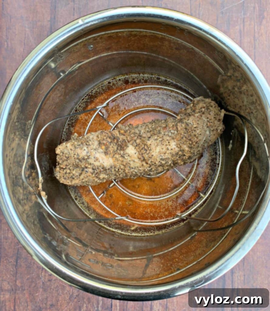 Keto Instant Pot Garlic Pepper Pork Tenderloin Veggie Bowls 6 cooked pork loin in an Instant Pot