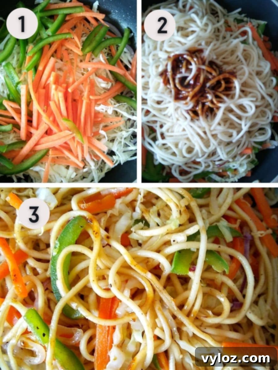 A wok filled with stir-frying vegetables and noodles, coated in sauce, illustrating the dynamic cooking process of chow mein.