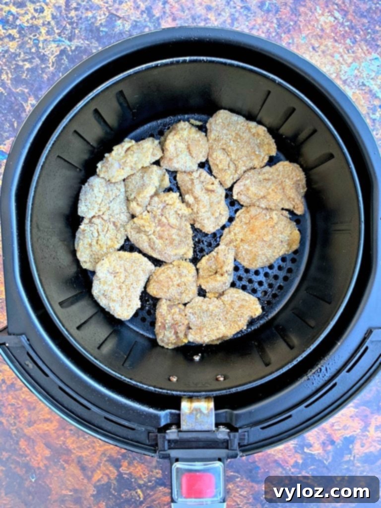 Crispy Air Fryer Chicken Nuggets 5 chicken nuggets in air fryer