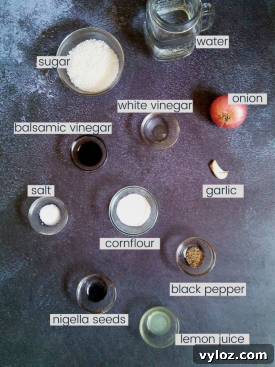 Image showing sweet onion dressing ingredients are placed on a black background, neatly arranged.