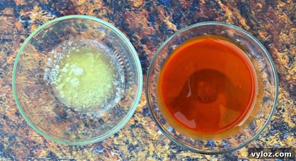 Crispy Air Fryer Buffalo Cauliflower 4 Bowls of melted butter and buffalo sauce, ready for coating cauliflower
