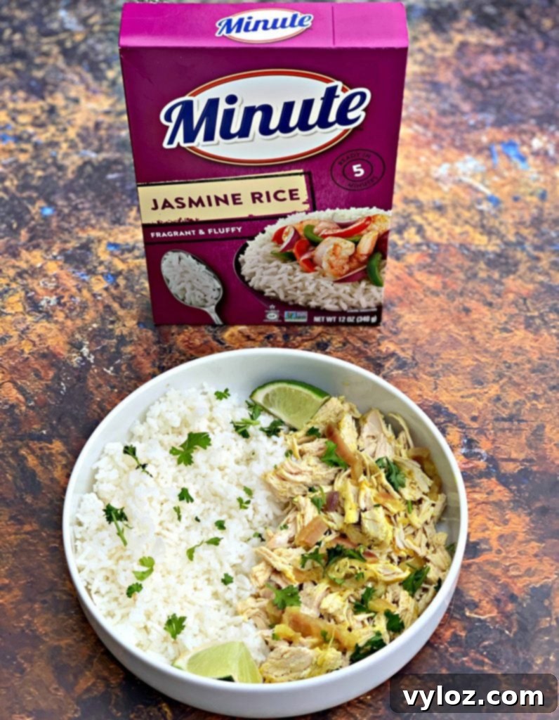 Easy Slow Cooker Curry Chicken Rice Bowls 2 curry chicken and jasmine rice in a white bowl