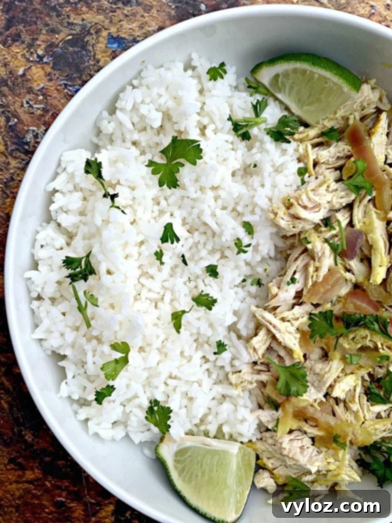 Easy Slow Cooker Curry Chicken Rice Bowls 6 curry chicken and jasmine rice in a white bowl
