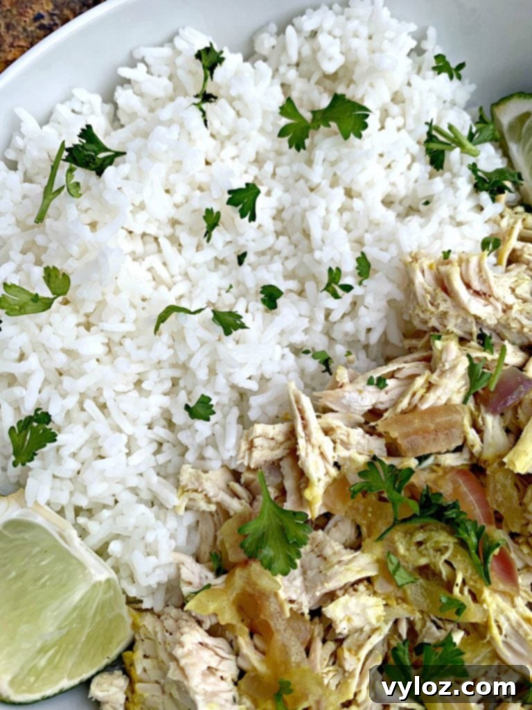 Easy Slow Cooker Curry Chicken Rice Bowls 8 curry chicken and jasmine rice in a white bowl