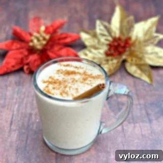 keto low carb egg nog in a mug with holiday decor in the background