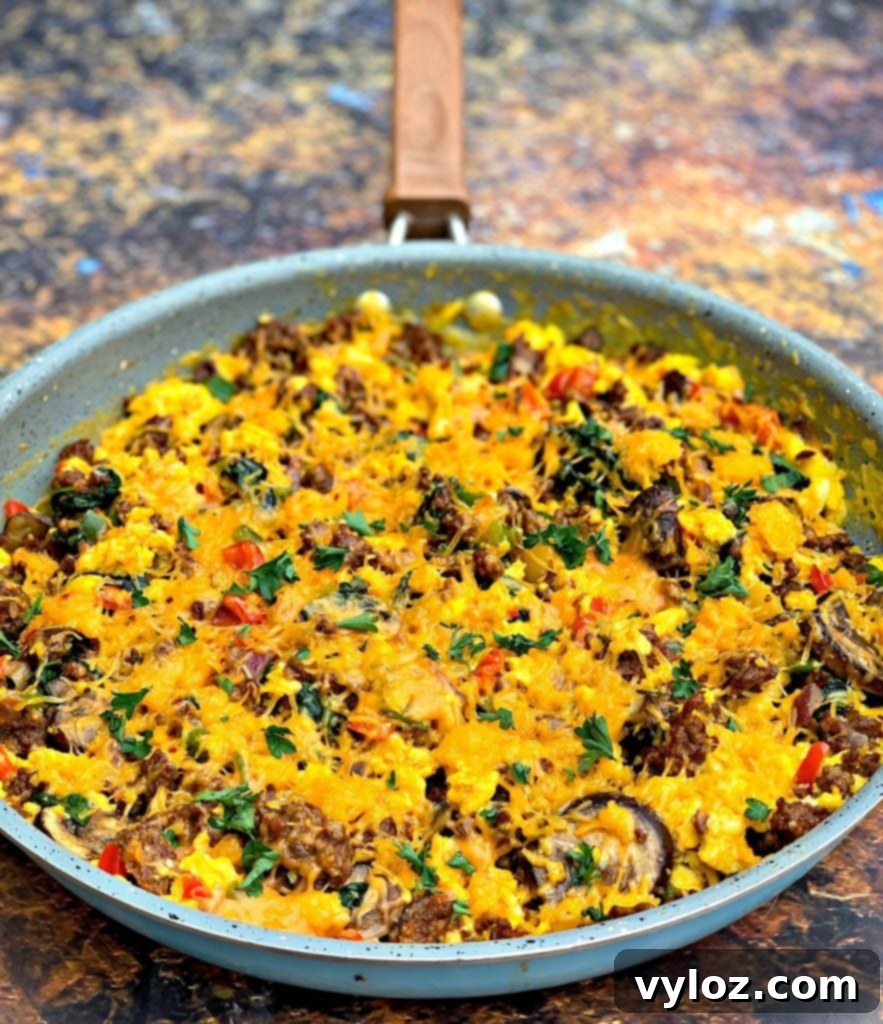 Keto Chorizo Egg and Cheese Breakfast Prep 2 keto low carb sausage breakfast scramble in a skillet