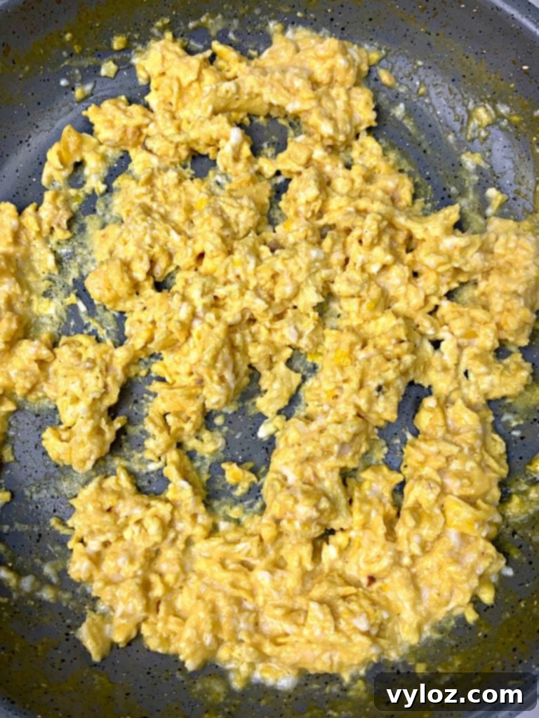 Keto Chorizo Egg and Cheese Breakfast Prep 7 scrambled eggs in a skillet