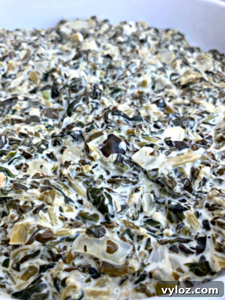 A close-up shot of keto low-carb creamed spinach, highlighting its rich texture and green color.