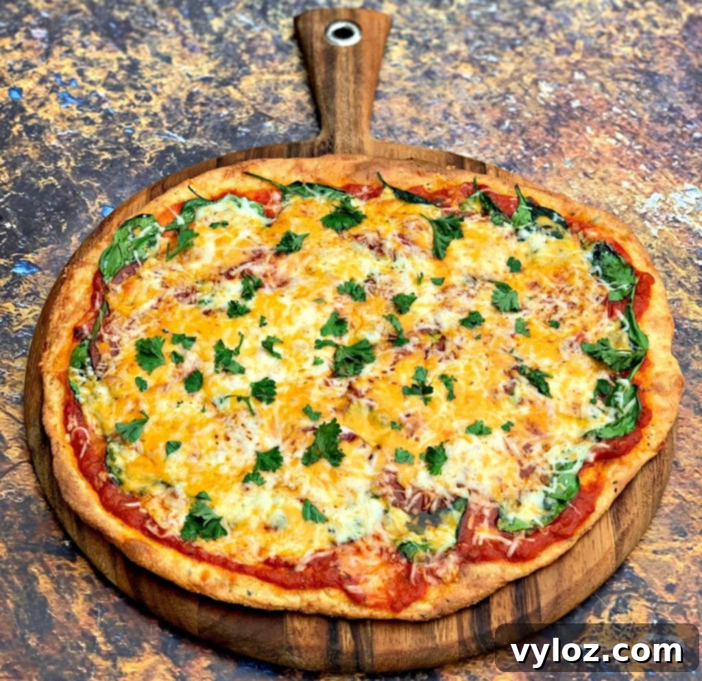 Delicious keto low carb pepperoni pizza on a rustic brown pan, perfectly baked and ready to be served.