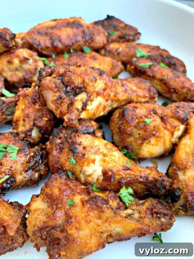 No-Fuss Sticky Honey BBQ Wings 8 A close-up shot of air fryer honey BBQ chicken wings, showing their texture and glaze.