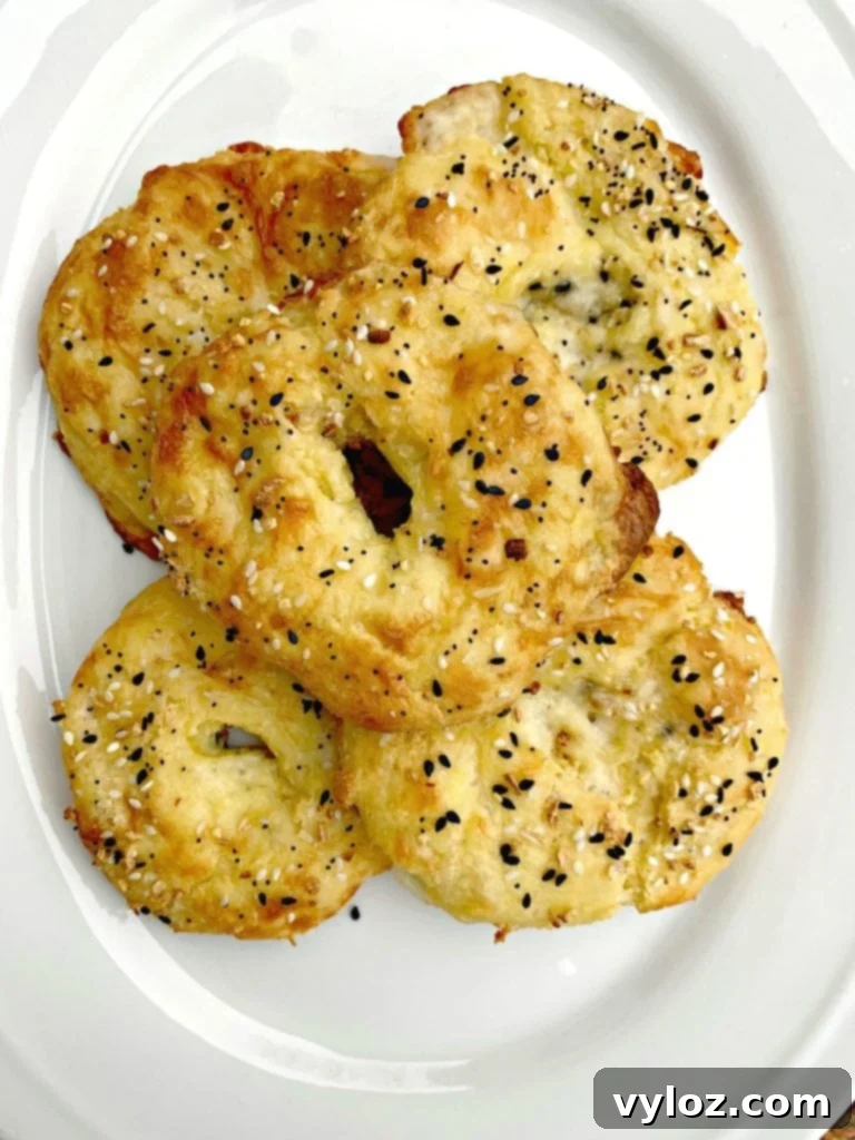 Cooked keto fathead bagels on a white plate