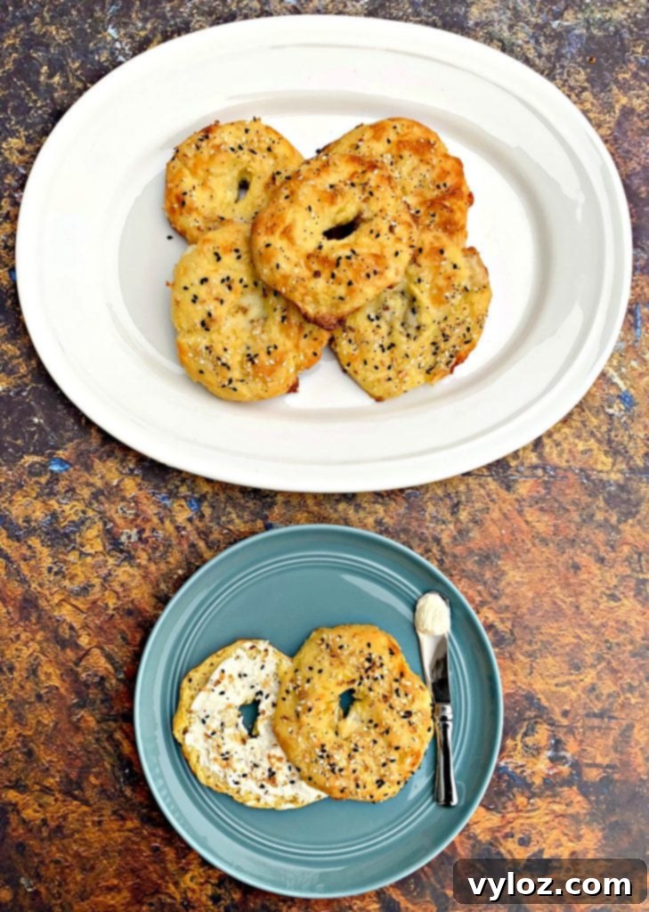 Cooked keto fathead bagels on a white plate