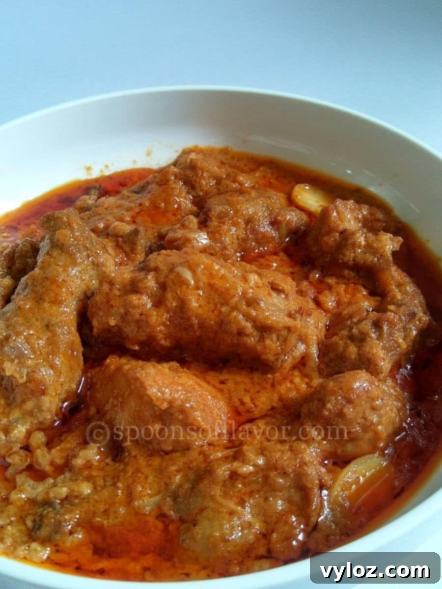 Homemade chicken korma served in a white bowl.