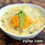 A beautiful bowl of keto low carb instant pot broccoli cheddar soup, rich and inviting.