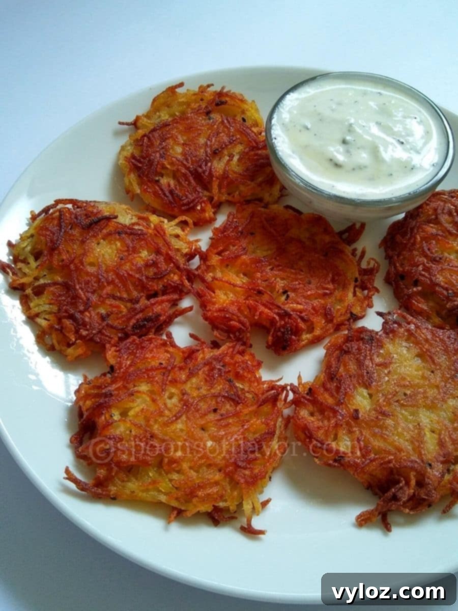 Potato fritters served with yogurt sauce.