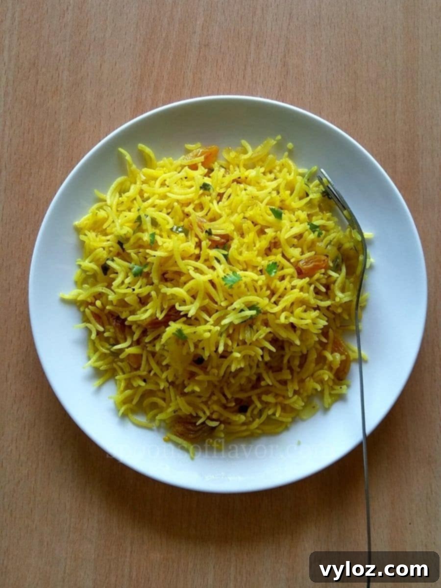 Mediterranean Sunshine Rice 2 Image showing vibrant looking yellow rice served on a white plate.