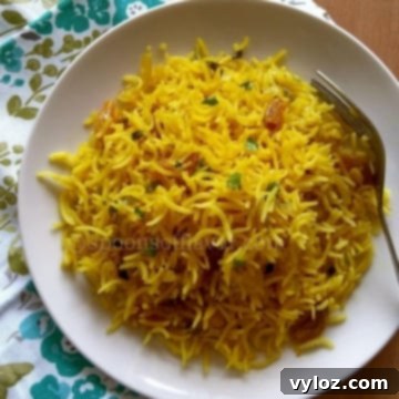 Mediterranean Sunshine Rice 7 Mediterranean yellow rice on a white plate