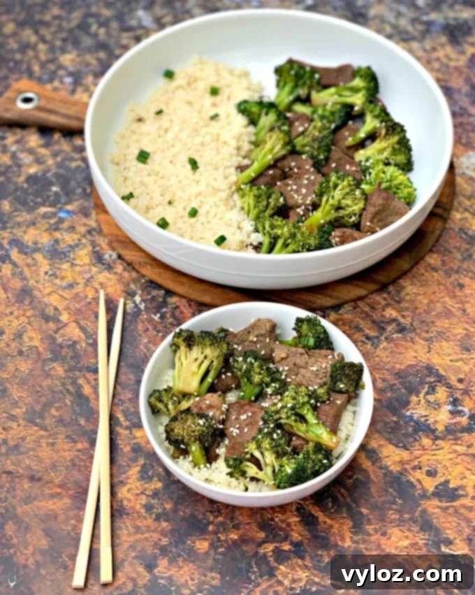 Delicious Keto Low Carb Beef and Broccoli stir fry in a white bowl with chopsticks, ready to eat