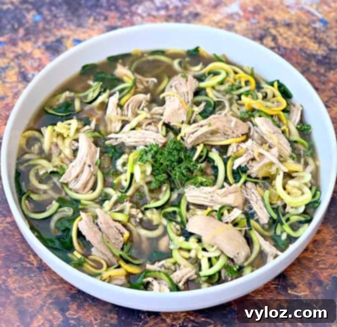 Keto Low Carb Instant Pot Chicken Zoodle Soup 2 keto low carb chicken noodle soup with zucchini noodles in a white bowl