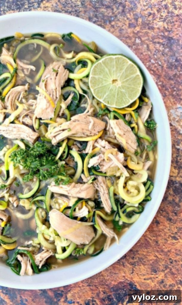 Keto Low Carb Instant Pot Chicken Zoodle Soup 8 keto low carb chicken noodle soup with zucchini noodles in a white bowl