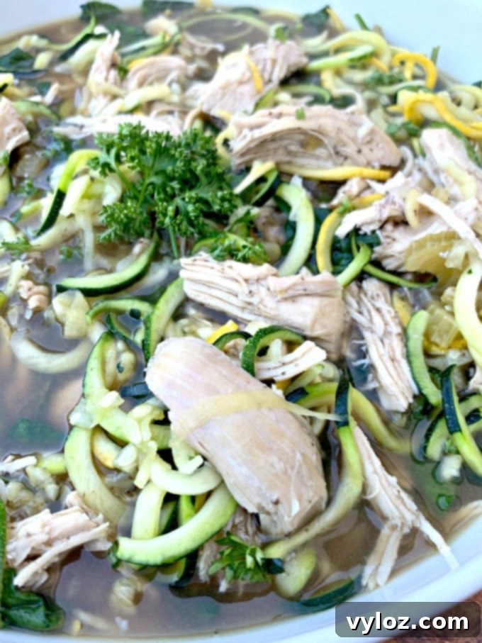 Keto Low Carb Instant Pot Chicken Zoodle Soup 10 keto low carb chicken noodle soup with zucchini noodles in a white bowl