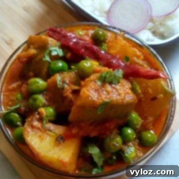 Kaddu Aloo Matar Sabzi is a simple, comforting pumpkin, potato and green peas semi-gravy recipe, perfect for any meal.