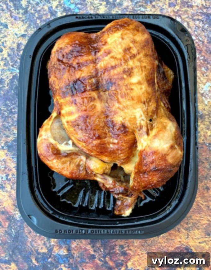 Cooked rotisserie chicken in its clear packaging, an easy start for meals