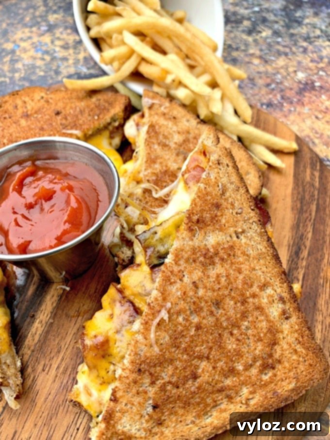 Crispy Air Fryer Grilled Cheese 5 Air fryer bacon grilled cheese sandwiches, perfectly melted, sliced and ready to serve