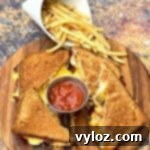 Crispy Air Fryer Grilled Cheese 7 air fryer bacon grilled cheese sandwiches sliced in half with french fries