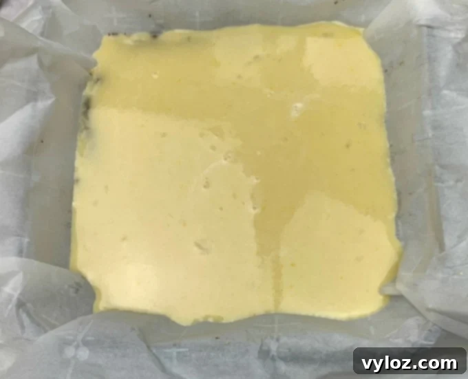 Simple Zesty Keto Lemon Bars 7 Keto lemon bars filling in a pan prior to baking