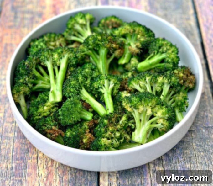 Crispy air fryer roasted broccoli served in a white bowl