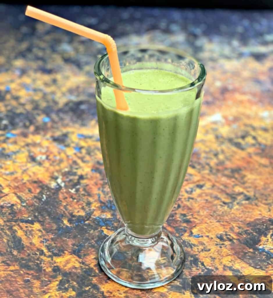 instant pot blender smoothie in a glass with a straw