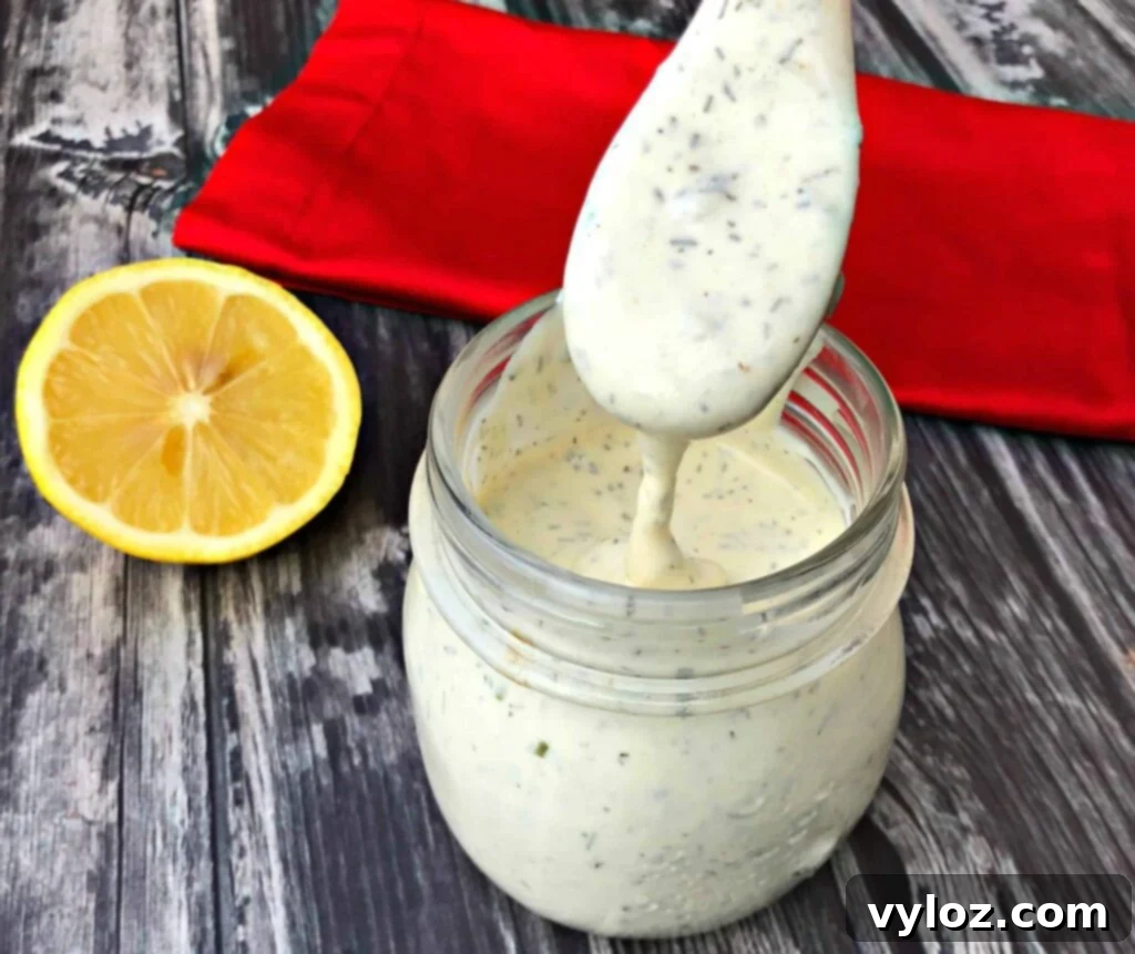 keto ranch dressing in a glass jar with a spoon