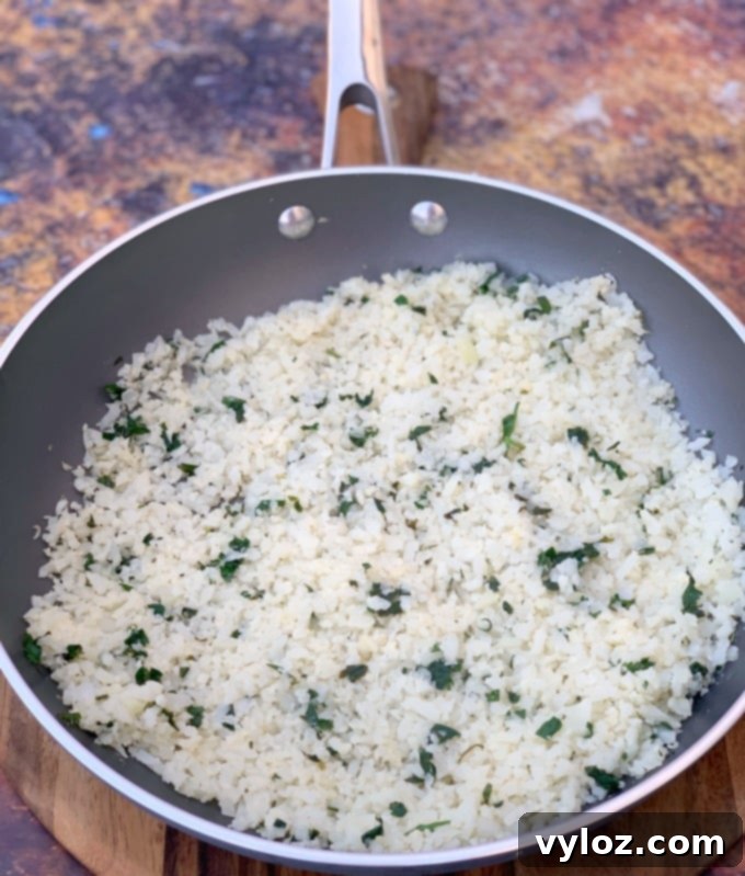 cilantro lime cauliflower rice in a skillet