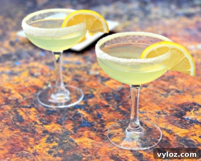 Sugar-Free Keto Lemon Drop Martinis 6 2 keto low carb lemon drop cocktail in a martini glass with lemon wedges on a white plate