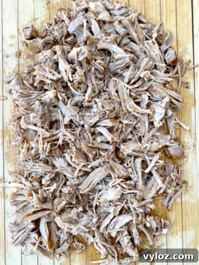 instant pot pulled pork on a cutting board